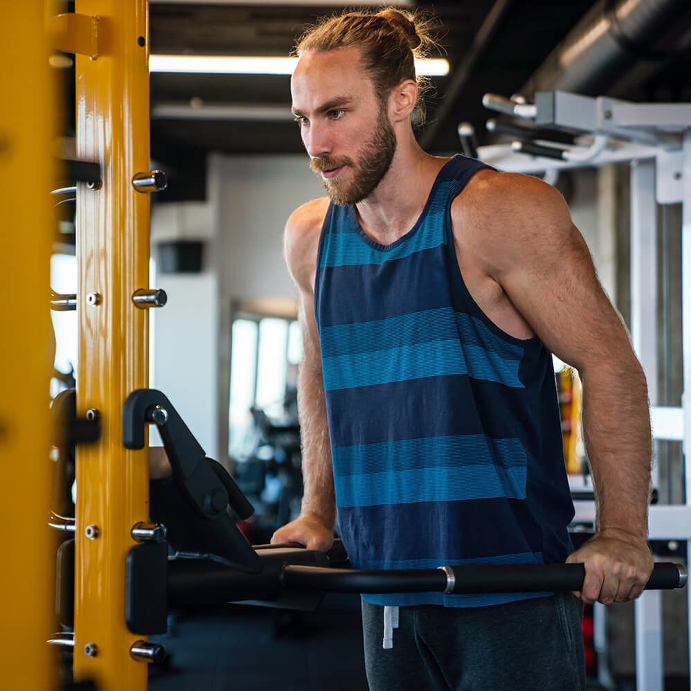 muscular-man-working-out-in-gym-doing-exercises-to-2025-03-16-00-54-57-utc (1)